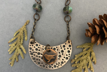 Little Bird Necklace made of copper and aluminum.